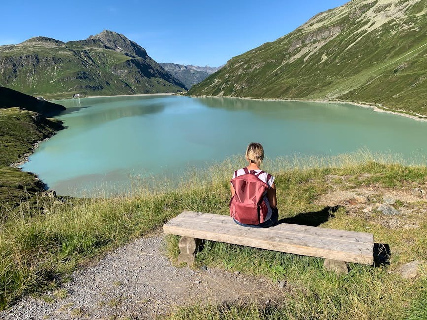 backpack on wooden bench mountain view