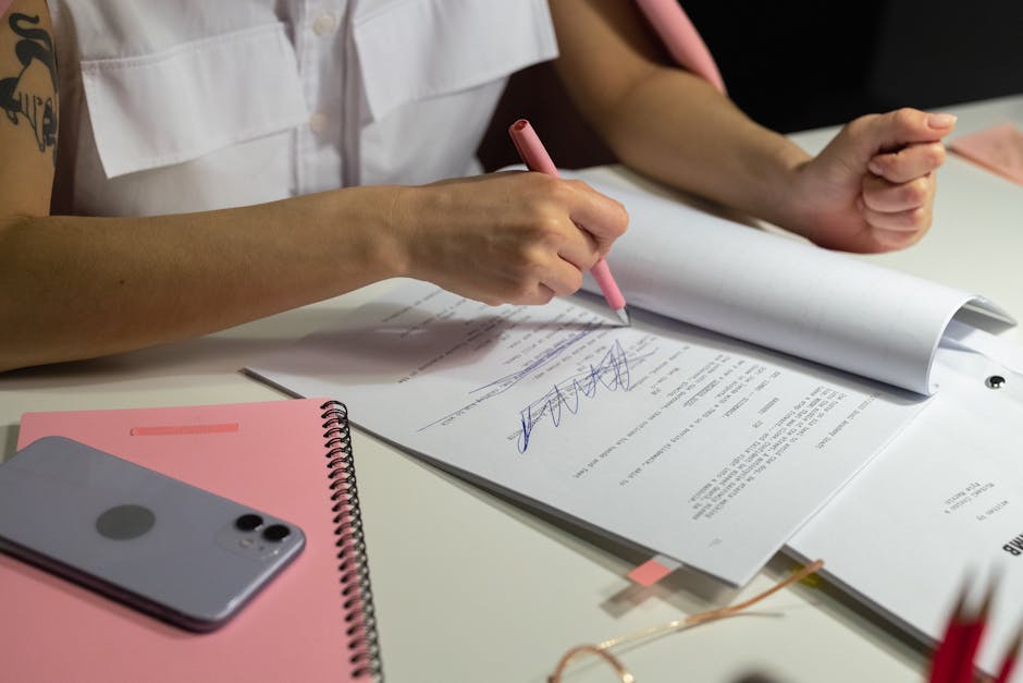businesswoman writing at desk with AI tools