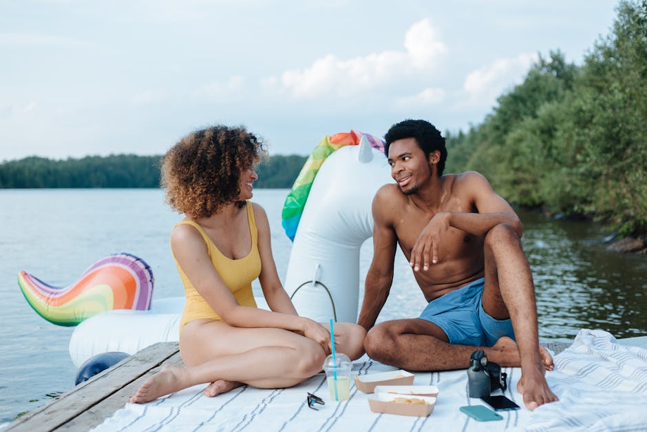 couple picnicking by a lake