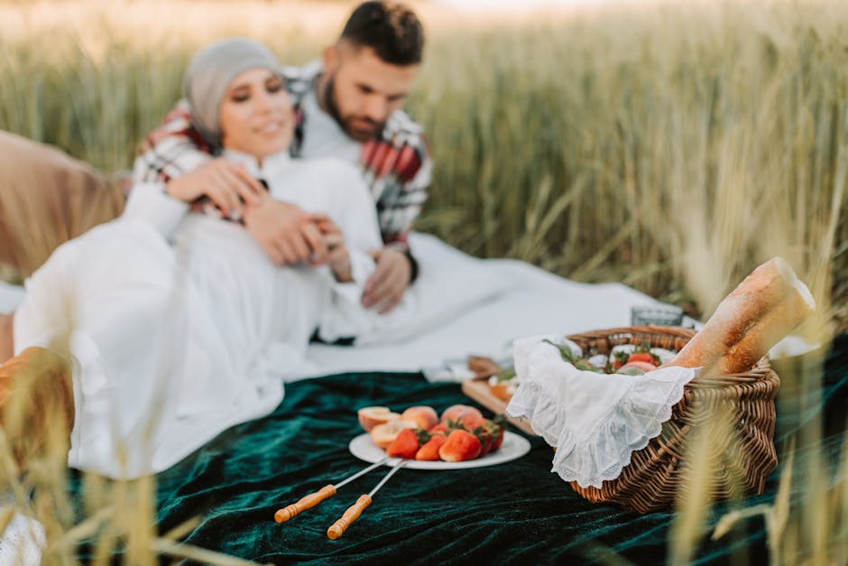 couple picnicking in field
