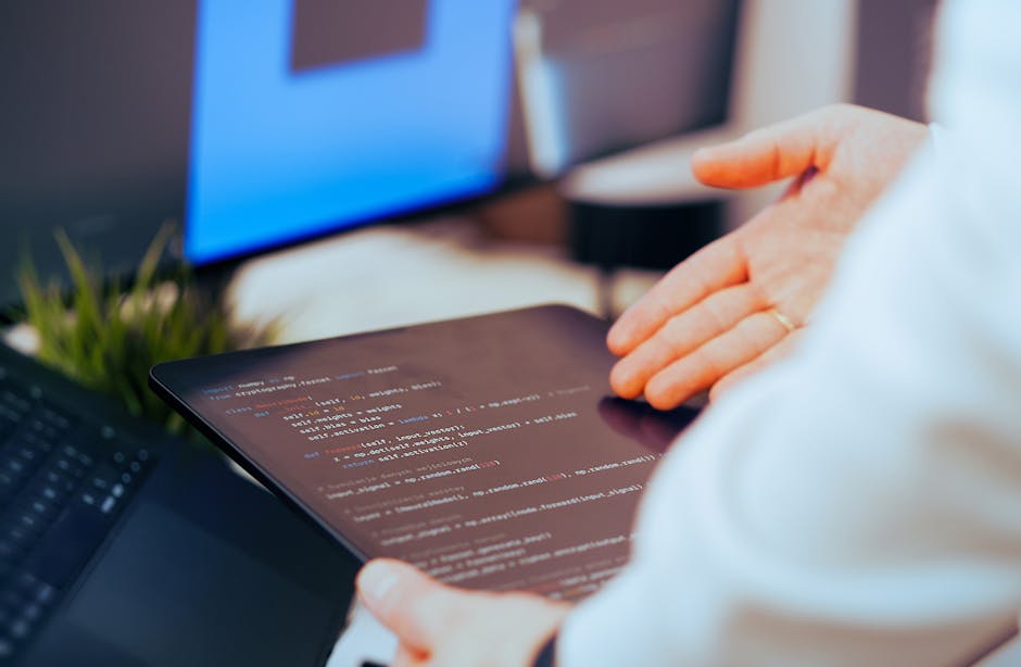 developer working on AI code with multiple screens