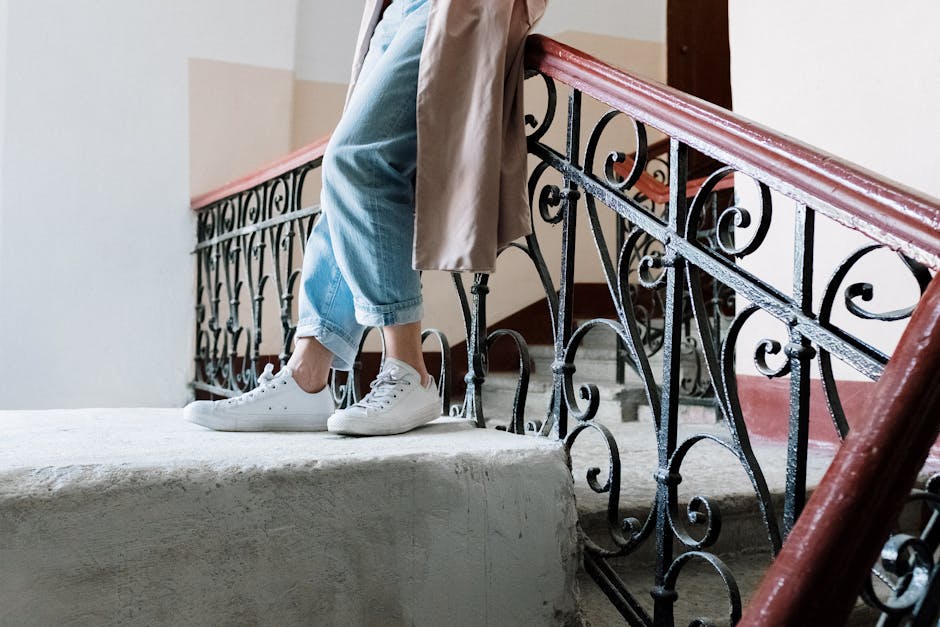 Fashionable woman with trench coat and sneakers