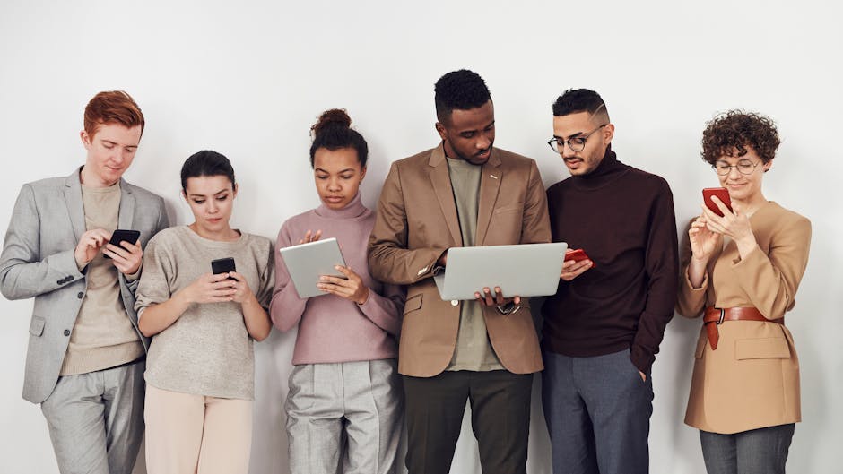 group of diverse people collaborating with digital tools