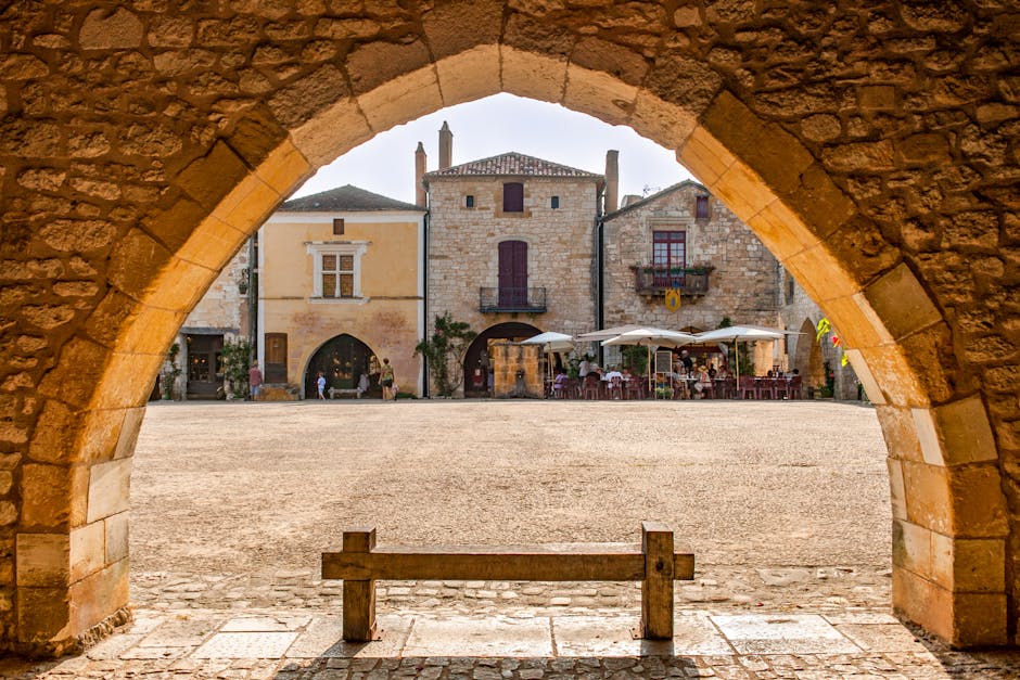 historic French village square with people