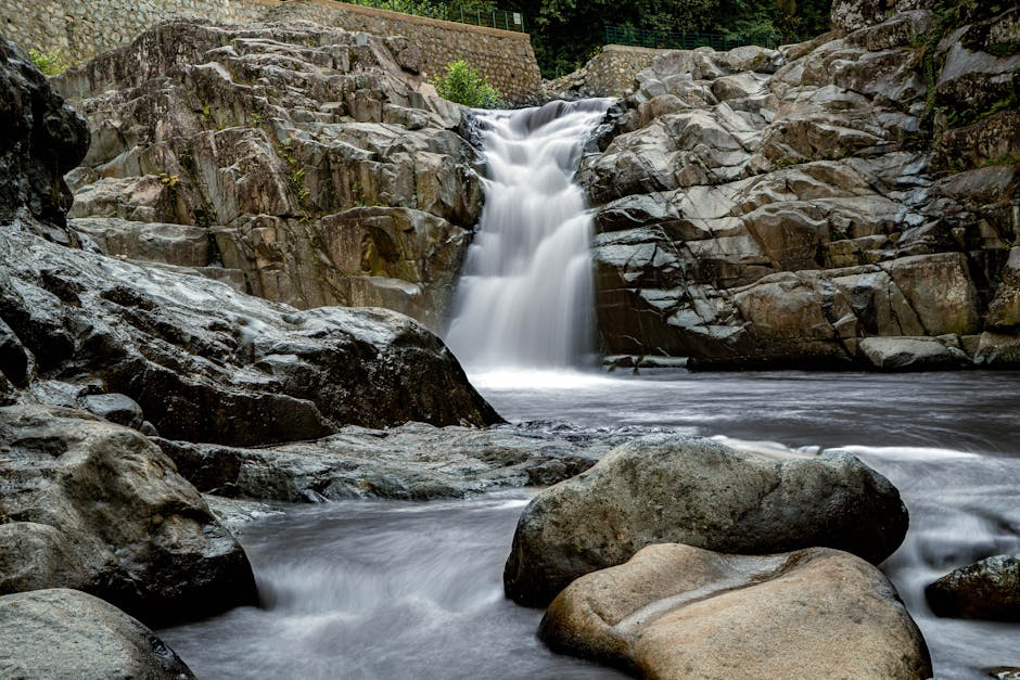 jagged rock formations waterfall jungle