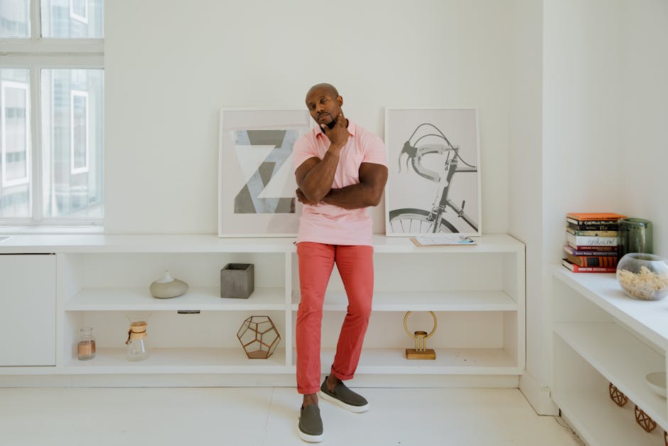 man dressing in minimalist modern apartment