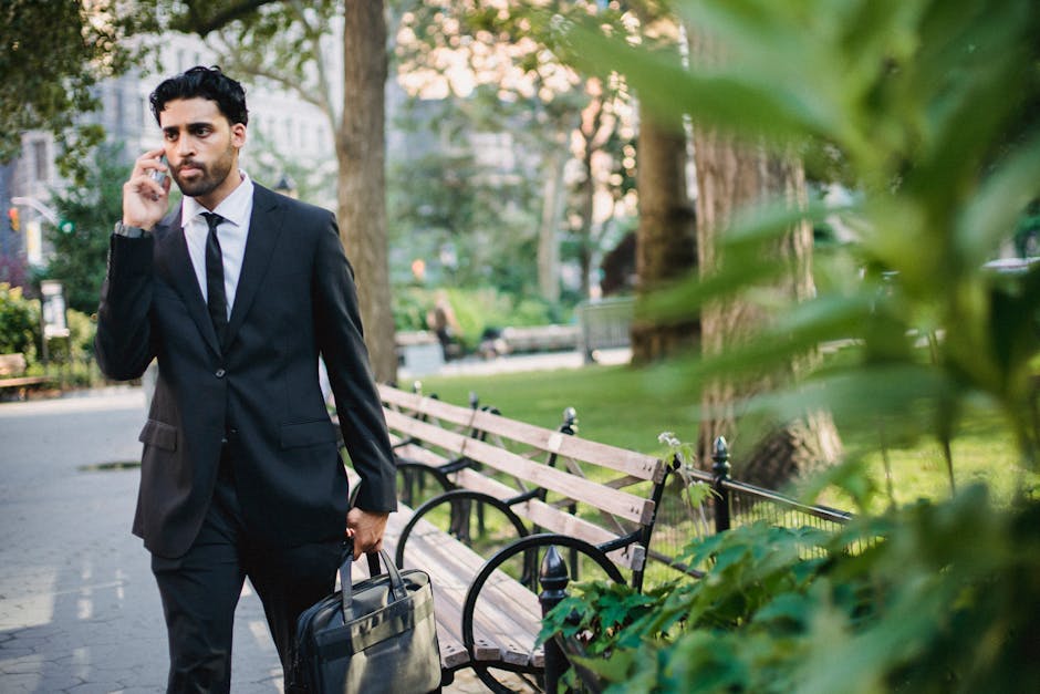 man in well-fitting suit walking in city