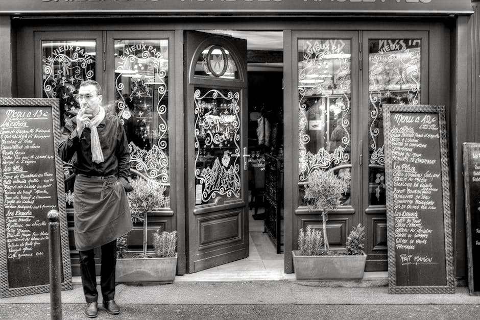 man sitting cafe paris