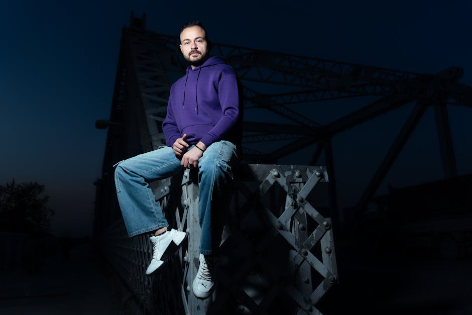 man wearing sneakers and hoodie city