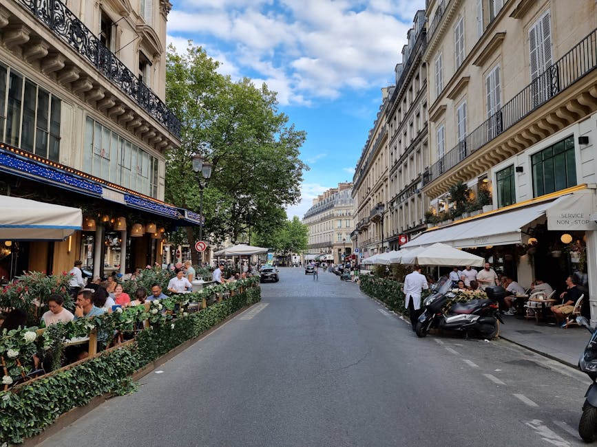 People drinking coffee outdoor cafe Paris