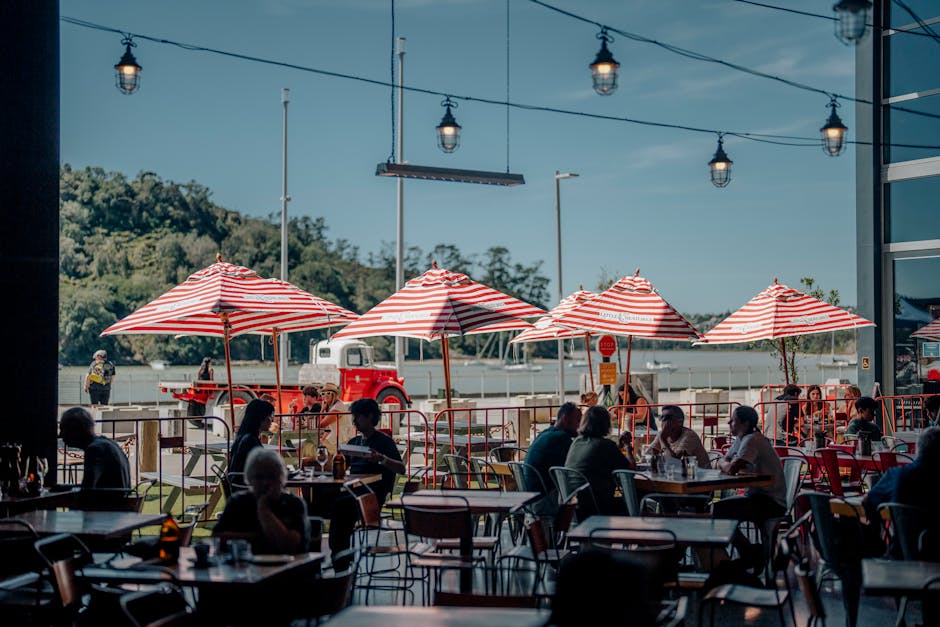 people enjoying summer day at beach cafe