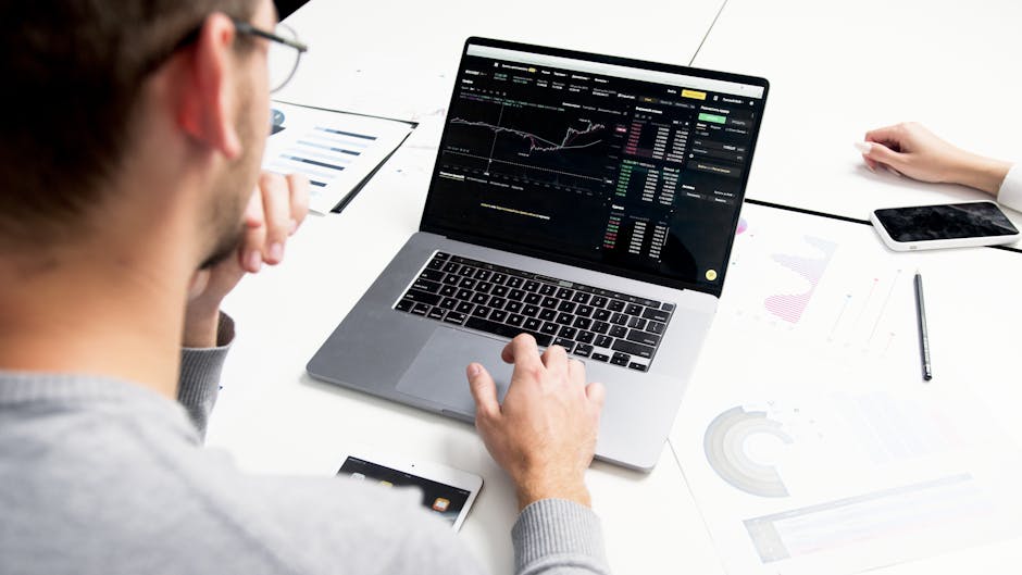 person analyzing data with graphs