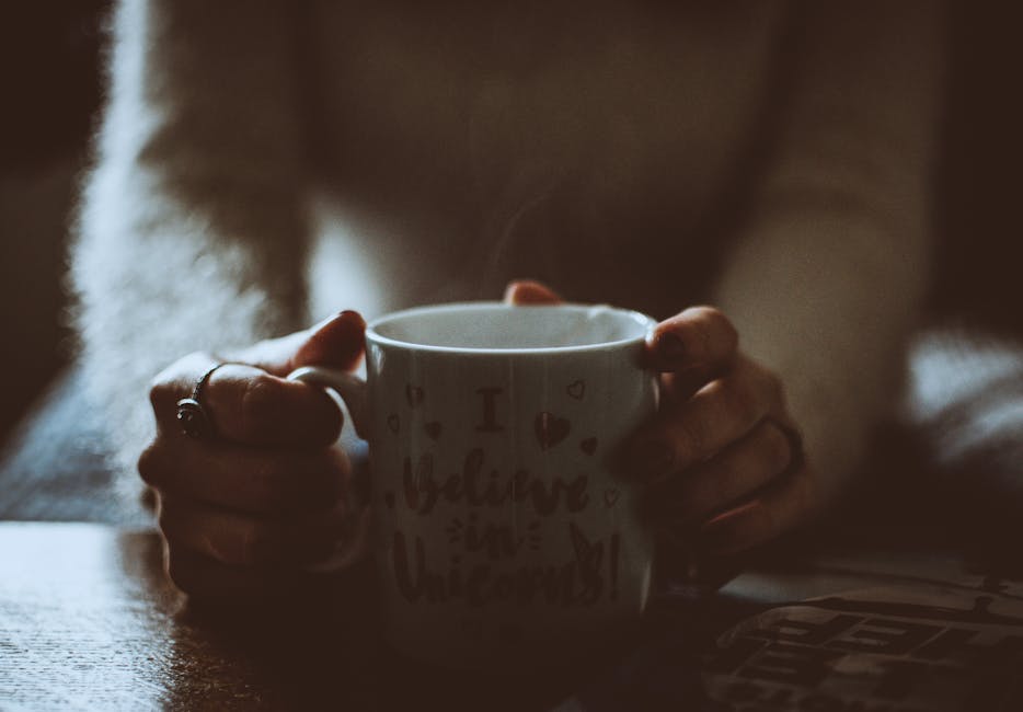 person drinking coffee winter morning