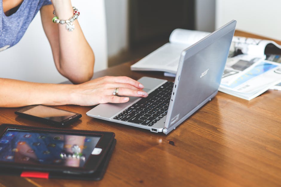 person happily working with computer and digital tools