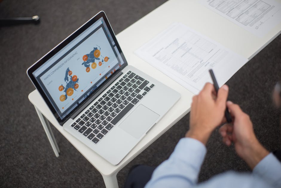 person translating documents on laptop