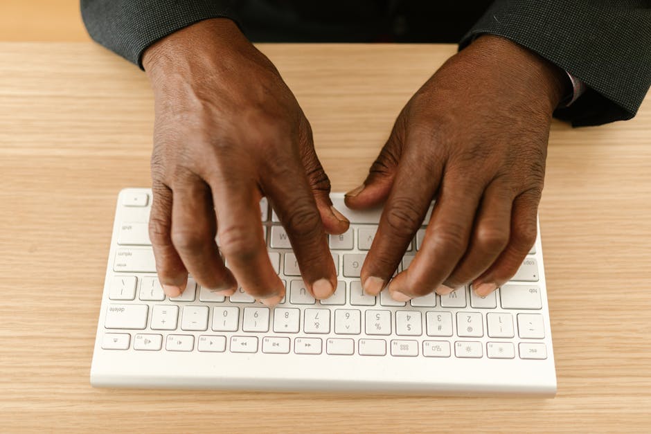 person typing on keyboard