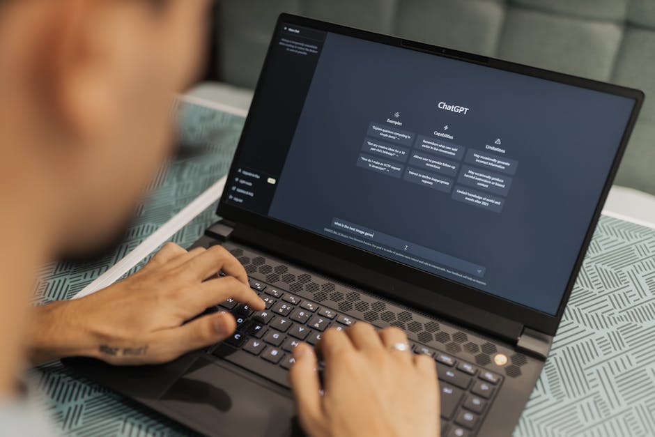 person typing on laptop with AI art on screen