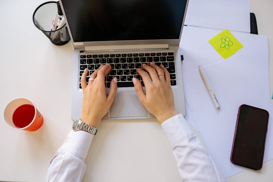 person working on laptop with productivity tools