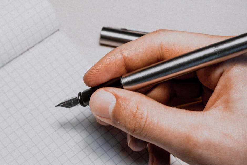 robot hand writing with a pen on paper