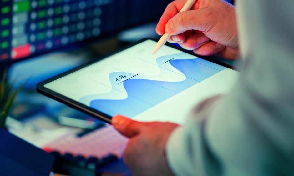 Small business owner reviewing data on tablet
