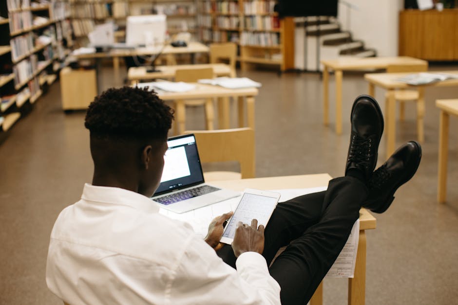 student in library using tablet