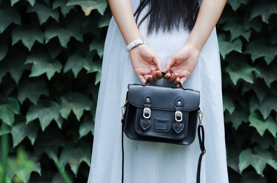 well-dressed woman holding elegant handbag