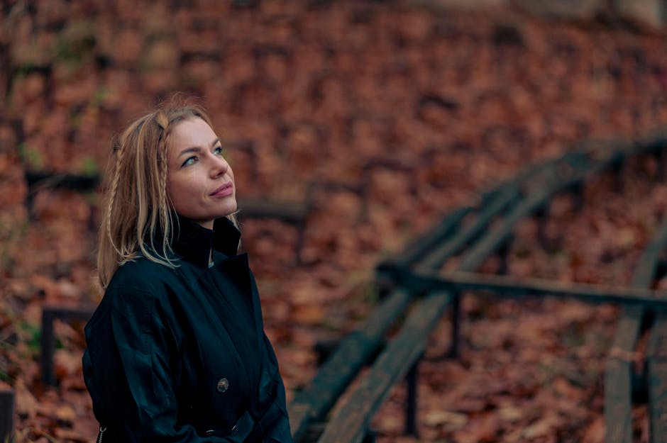 woman autumn leaves park