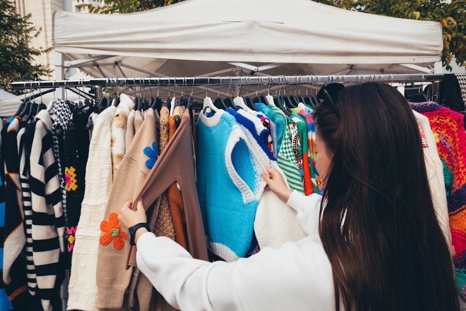 woman browsing clothes in a colorful market