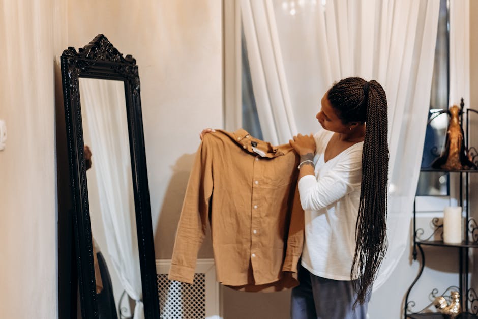 woman combining clothes in front of mirror