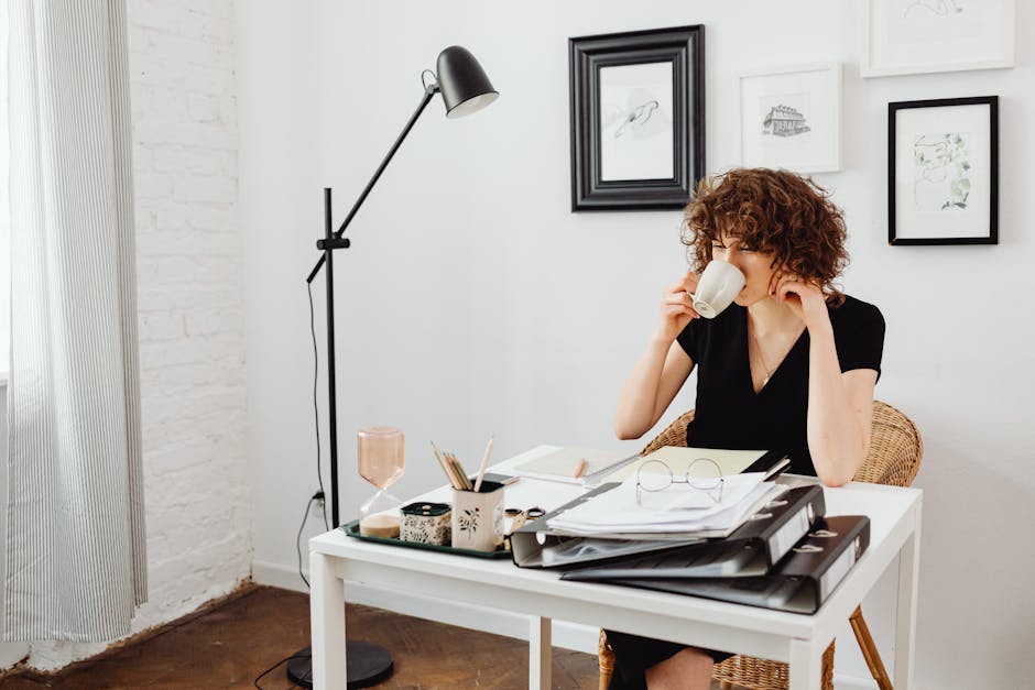 woman drinking coffee in stylish minimalist office