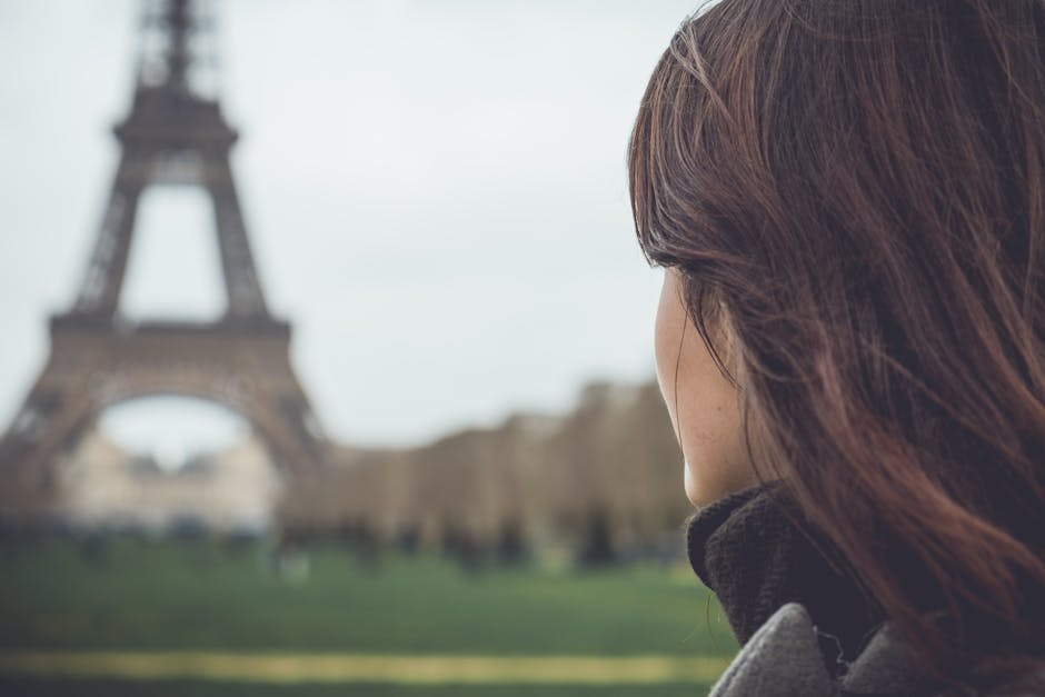 woman in warm winter coat eiffel tower