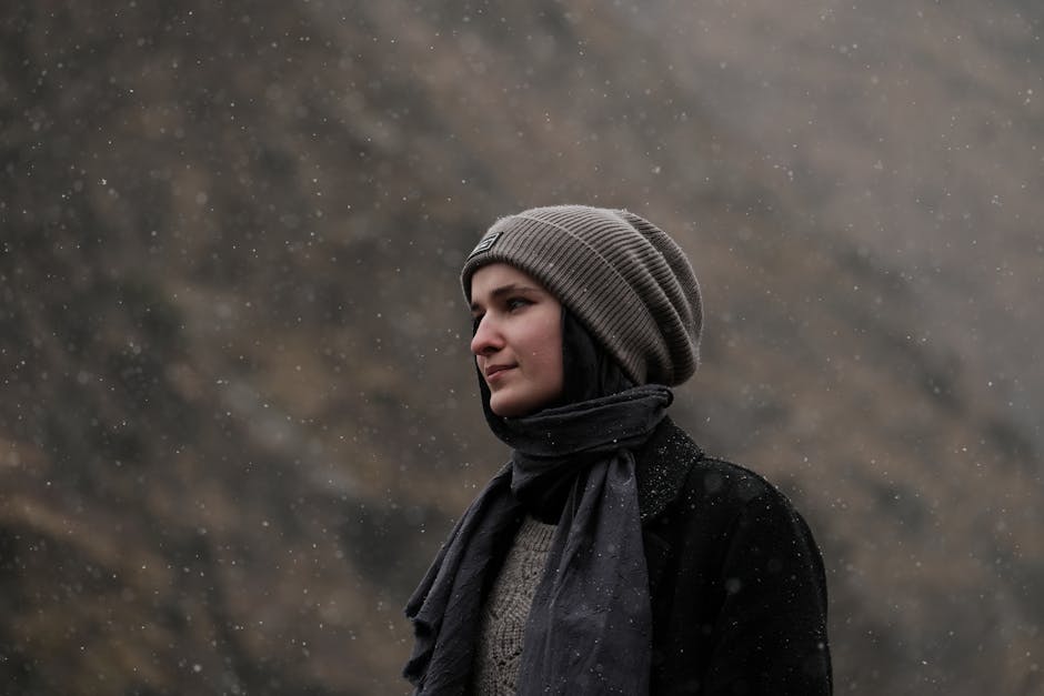 woman layering clothes for different weather
