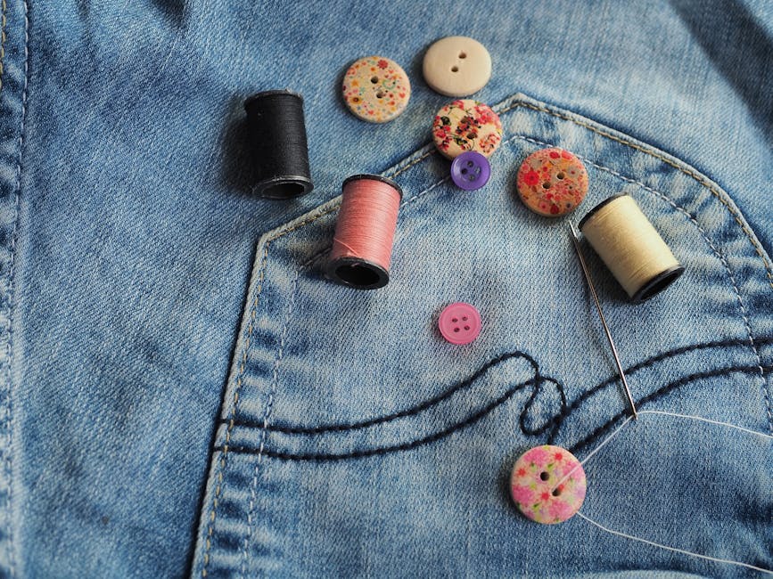 woman sewing old jeans
