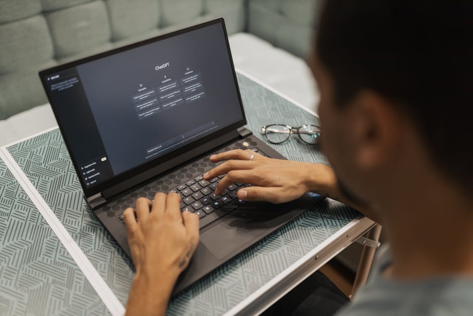 woman typing on laptop with AI assistant on screen