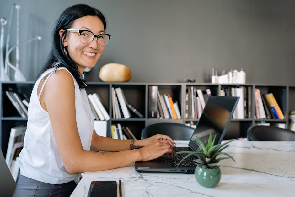 woman using a laptop in a modern office