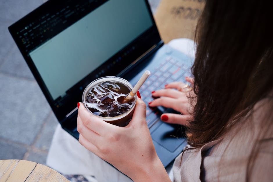 woman using laptop in coffee shop in Germany