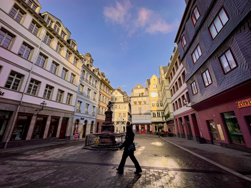 woman walking by historic german architecture