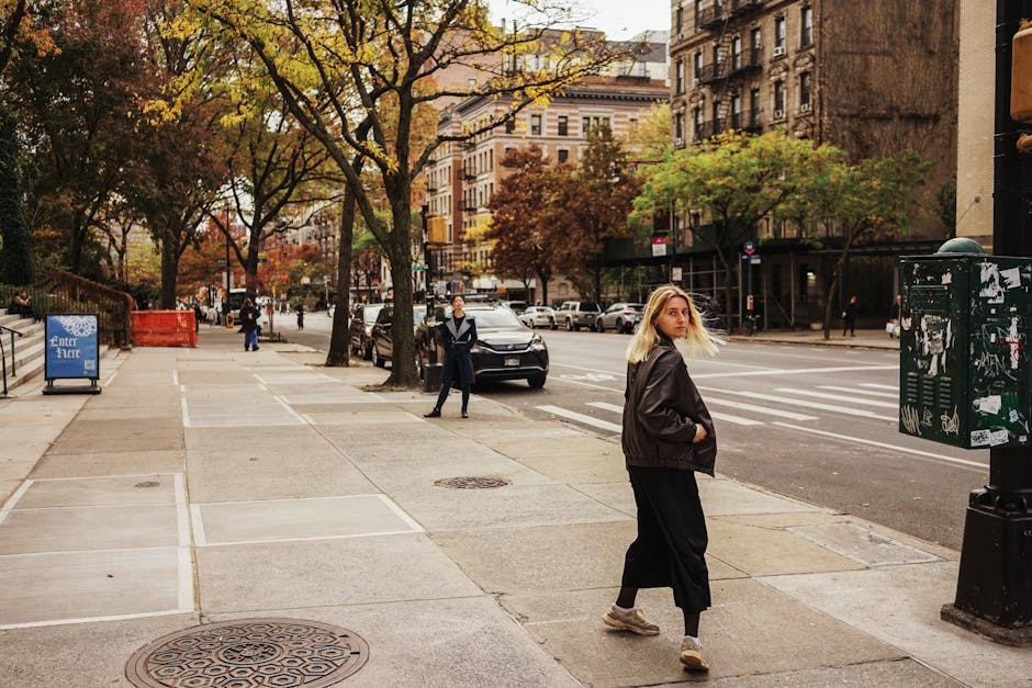 woman walking city street autumn