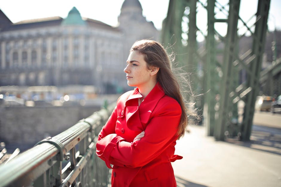 woman wearing trench coat urban setting