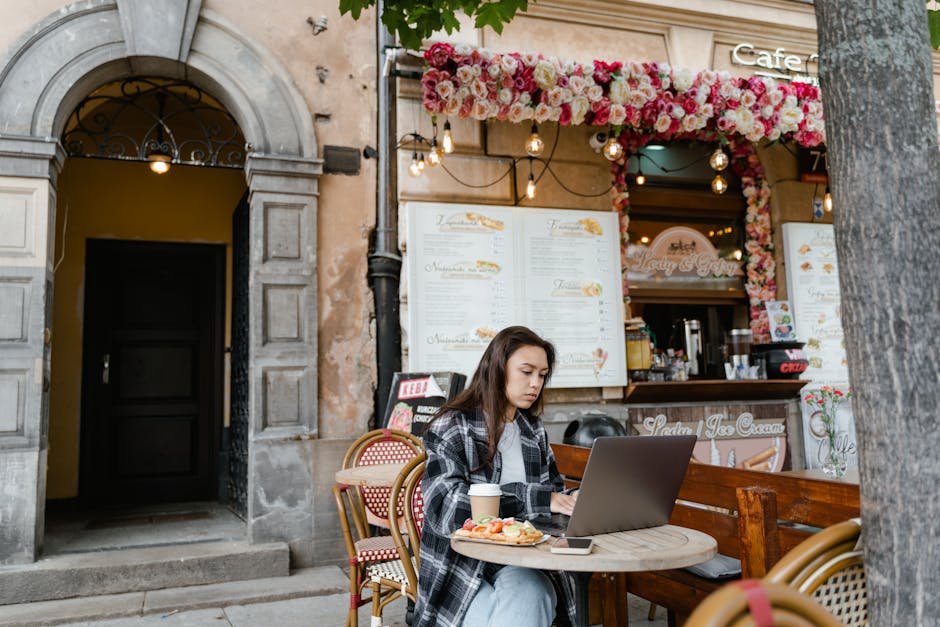 woman working on laptop cafe