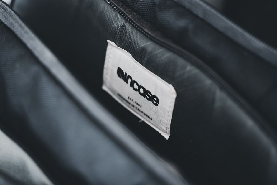 A close-up shot highlighting the slash-resistant fabric and lockable zippers of an anti-theft bag, demonstrating its key security features.