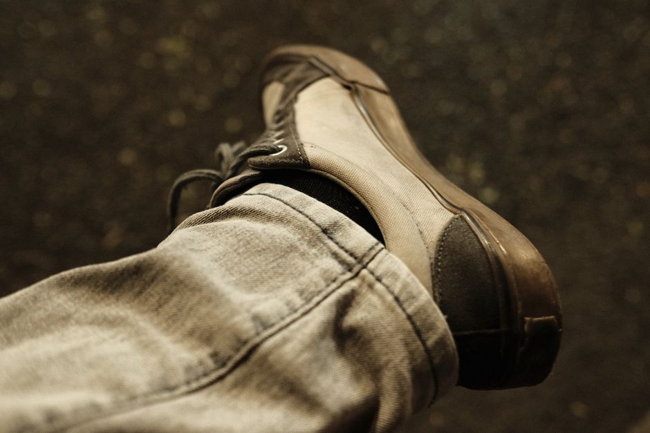 Close-up of a person's foot inside a well-cushioned and supportive office shoe, highlighting the arch support and wide toe box.