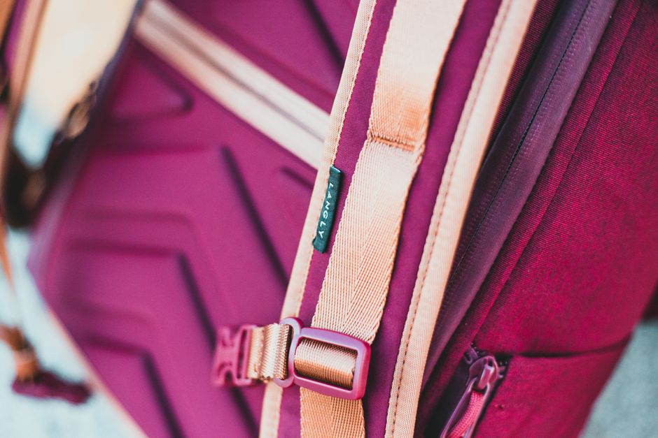 Close-up shot of durable, water-resistant fabric and a high-quality zipper on a laptop bag, emphasizing material strength and security.