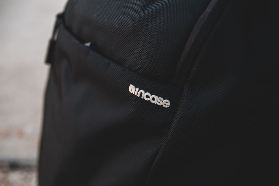 A detailed close-up shot of a bag's durable, water-resistant fabric and a high-quality, sturdy zipper, illustrating the importance of material and construction.