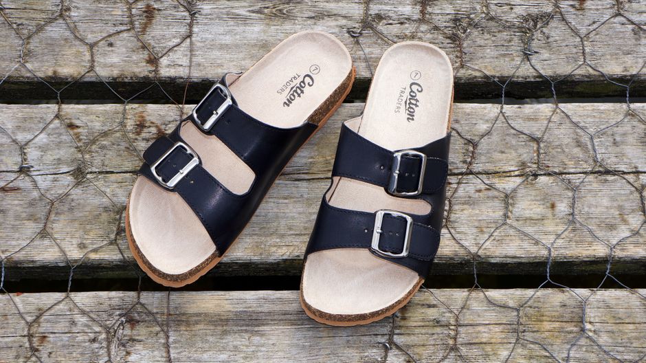 Detailed view of the cushioned footbed and arch support of a walking sandal, emphasizing its comfort features.