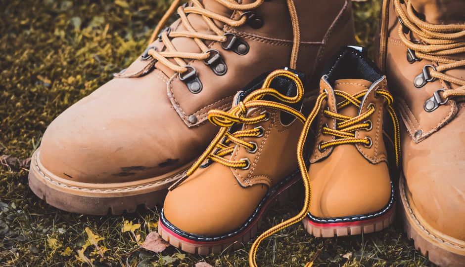 An organized display of various types of comfortable walking shoes, including athletic sneakers, stylish travel sneakers, and light hiking shoes.