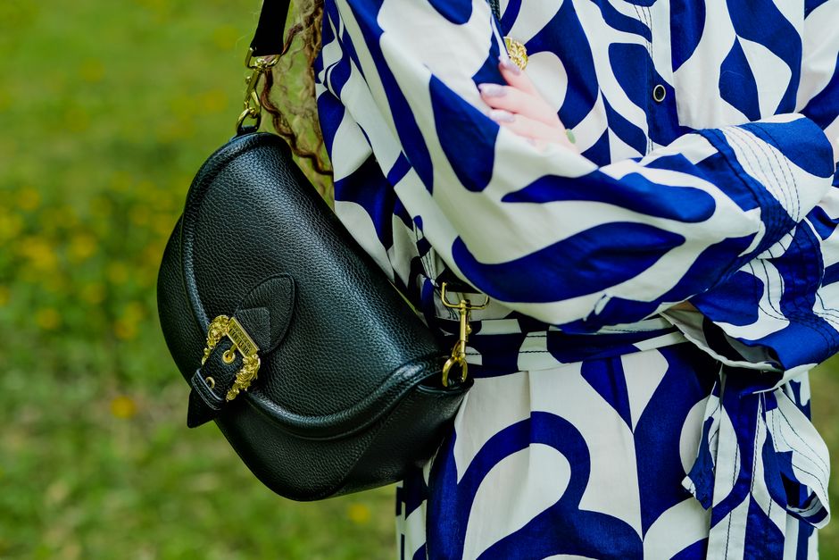 Close-up of a crossbody bag showcasing its anti-theft features like locking zippers and slash-resistant fabric.