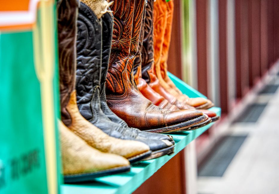 Three different styles of winter boots, including a hiking boot, an urban commuter boot, and a snow boot, displayed side-by-side.