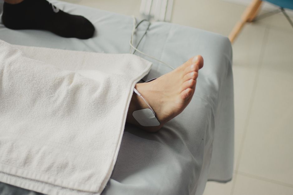Close-up of a foot with a protective blister plaster applied to the heel, showing prevention.