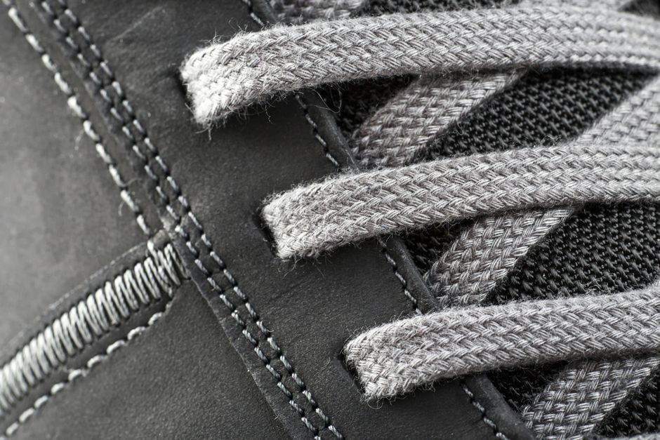 Close-up of a modern walking shoe highlighting its cushioned sole, breathable upper, and supportive design.